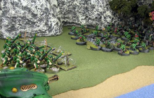 A unit of Firewarriors bravely faces a mob of Orks and Gretchin