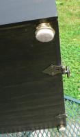 The hinges sit over the bottom of the front door.
