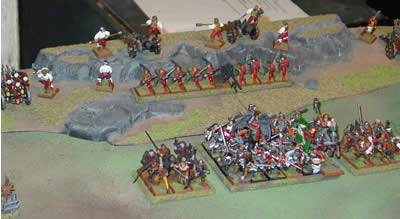 Back row: Rocket Battery, Two Great Cannons, Helblaster Volley Gun guarded by 10 Handgunners. Front row: Sword block with the Emperor Karl Franz and a Battle Standard Bearer, protected on the flanks by 9 Free Company detachments on either side