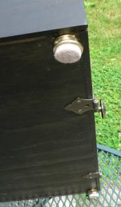The hinges sit over the bottom <br/>of the front door.