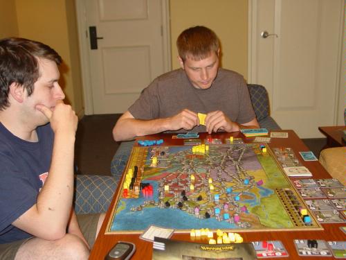 Brian P, jmisuinas, Malfred and Grand Preceptor (not pictured) playing Power Grid in a hotel at GenCon 2008
