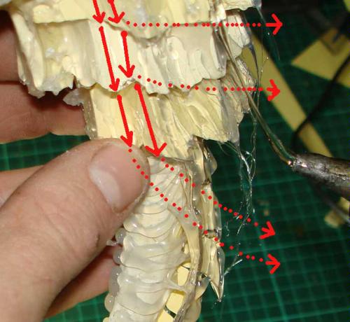 Hold upside down and draw glue lines down from the base.